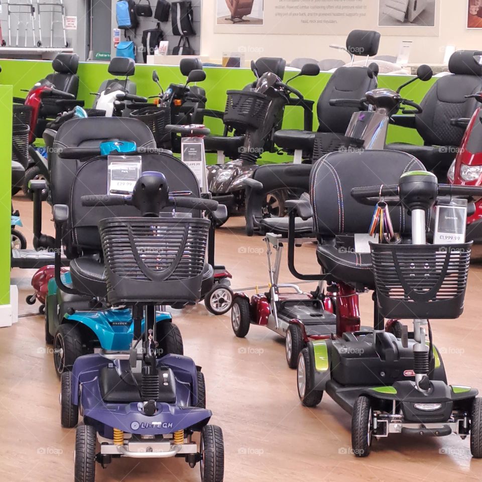mobility scooters for sale un a U.K shop wheels baskets