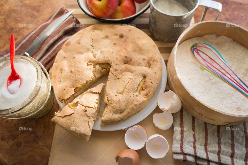 Making homemade puffed apple pie with eggs, sugar and flour.