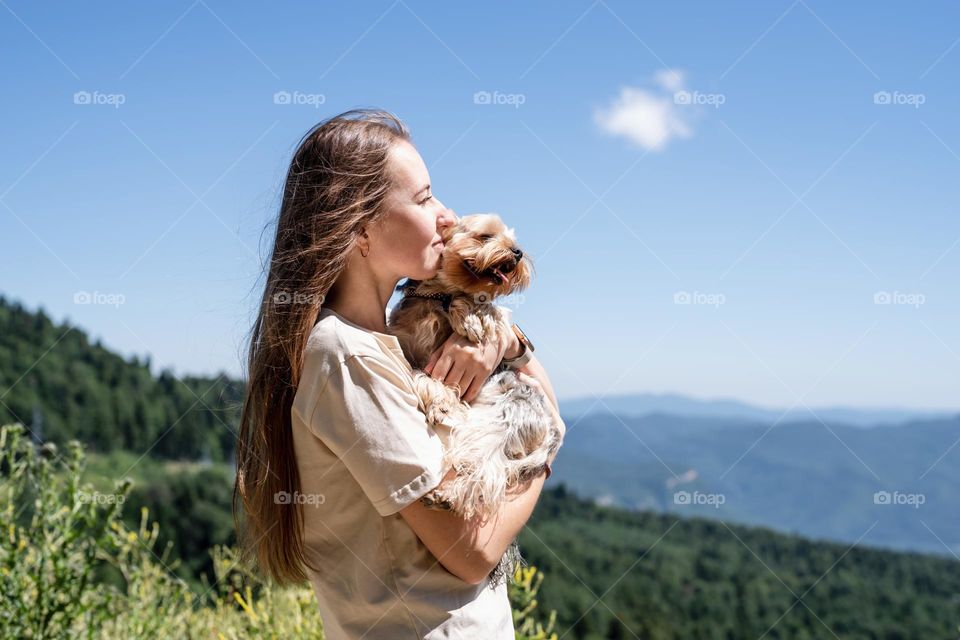 woman hiking with dog