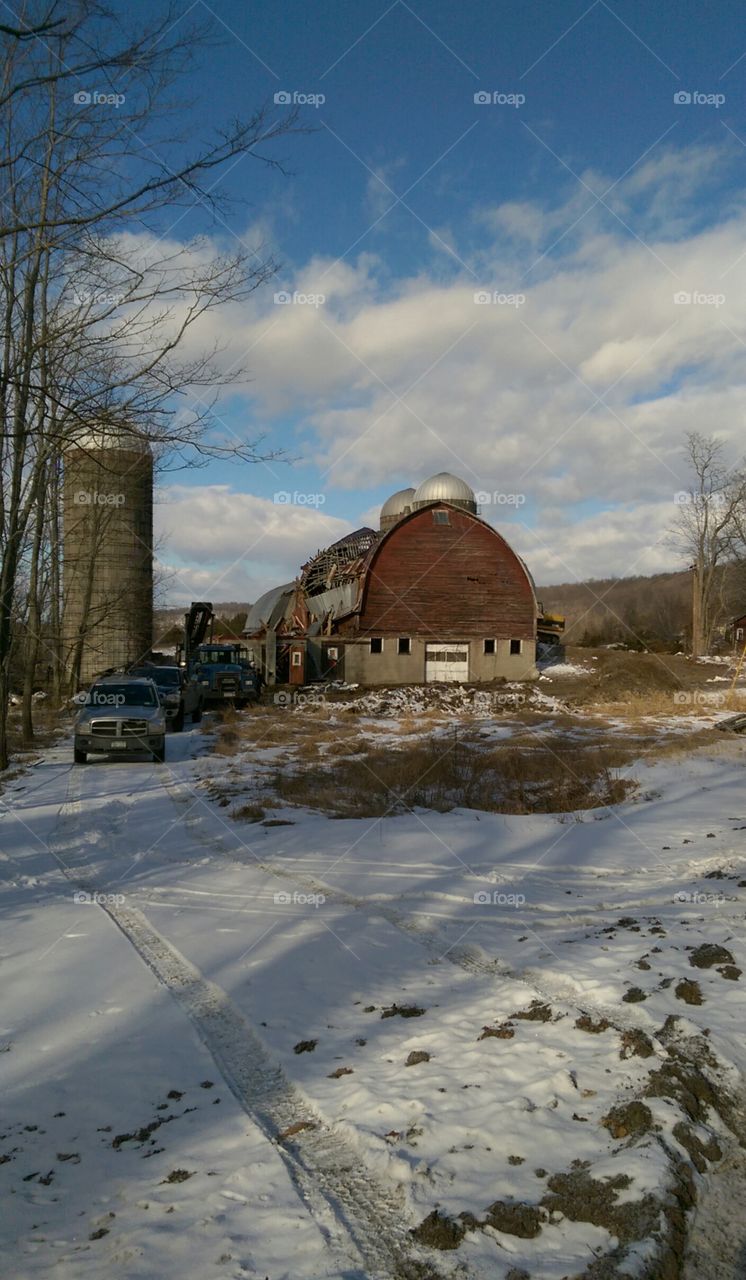 Demolishing an abandoned barn