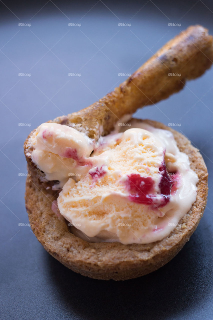 Ice cream in a cookie bowl. Cherry ice cream in a choc chip cookie bowl with a cookie spoon 