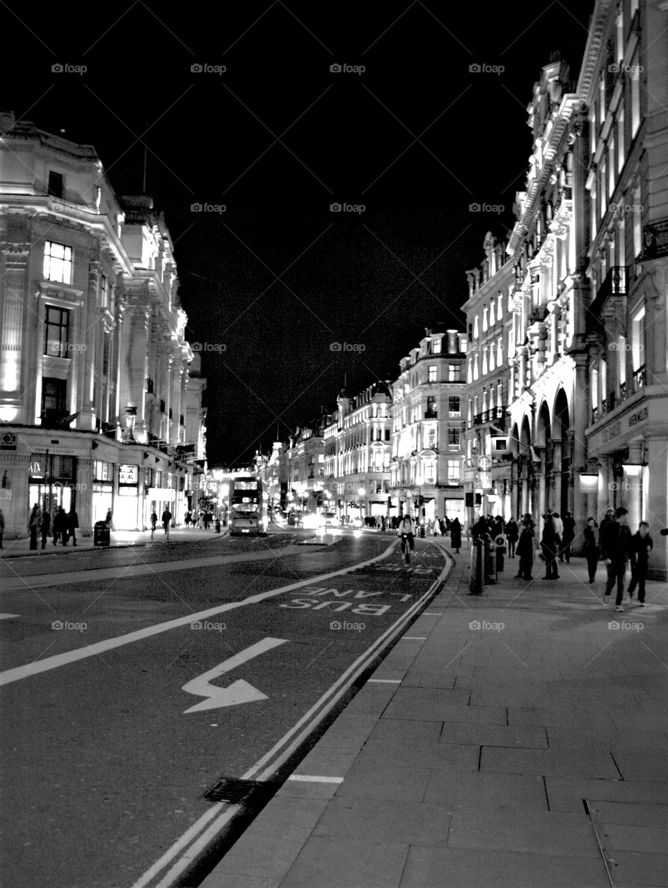 Black and white picture of Regent's Street, London at nighttime 