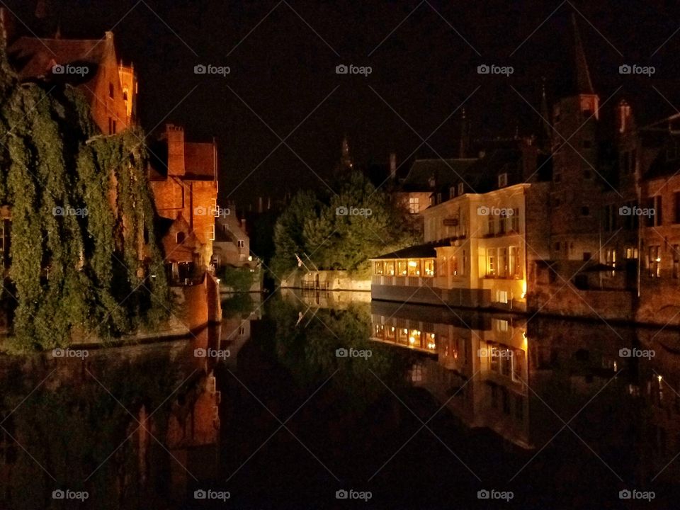 beautiful architecture reflection of night view in brugge