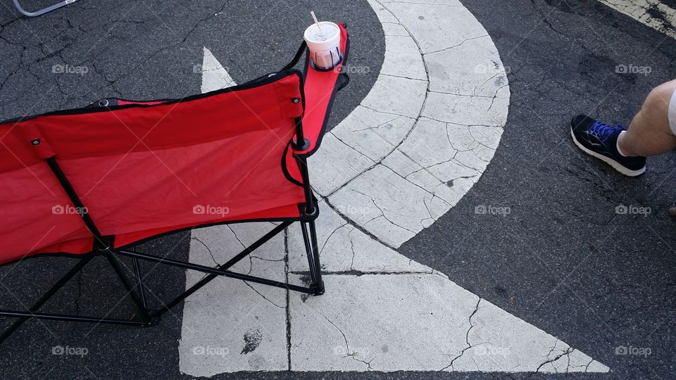 art red folding chair turn arrow foot tennis shoe