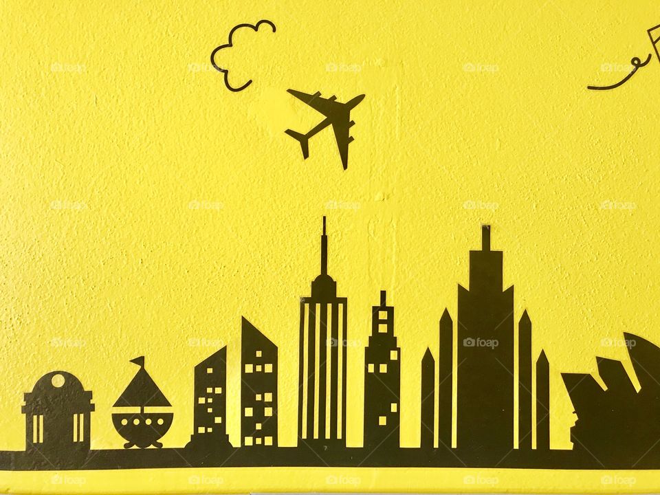 Cityscape on yellow wall background