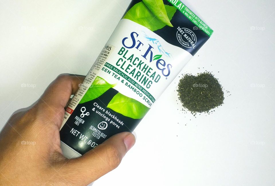 St. Ives - Blackhead clearing - green tea and bamboo scrub in a hand with green tea in the background- Beauty products I love