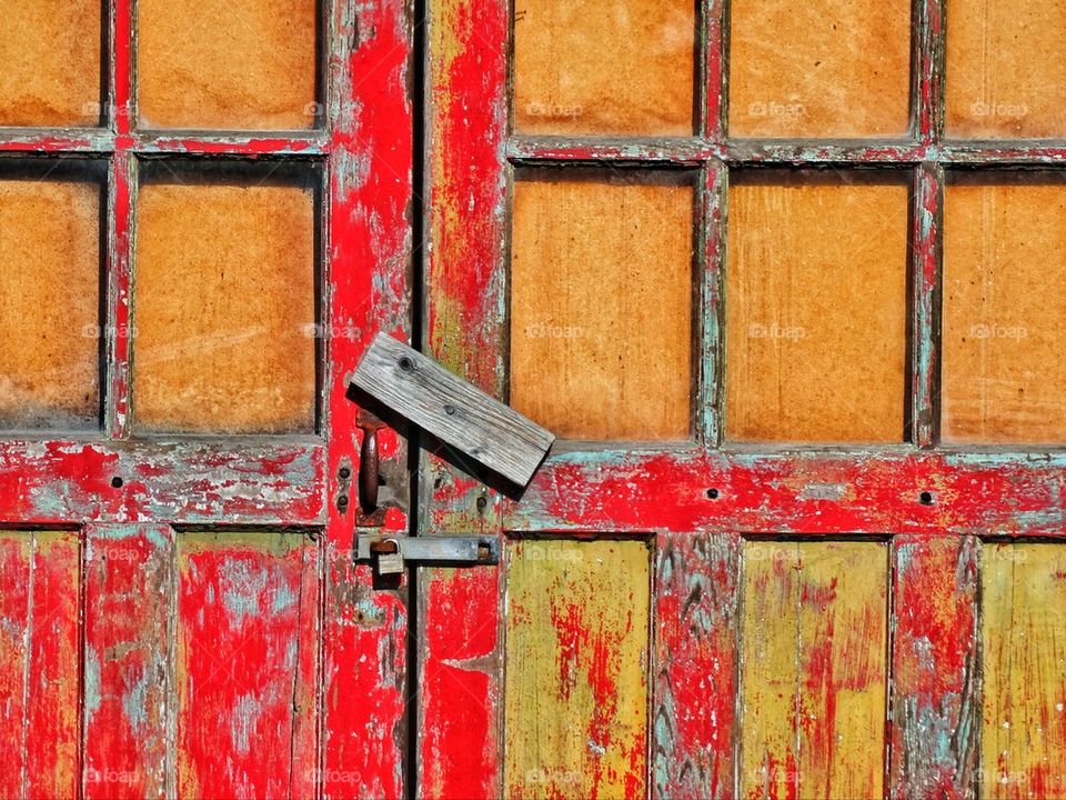 Rustic faded chipped paint on a barn door