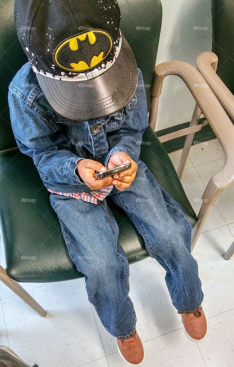 Playing my game sitting in the waiting area