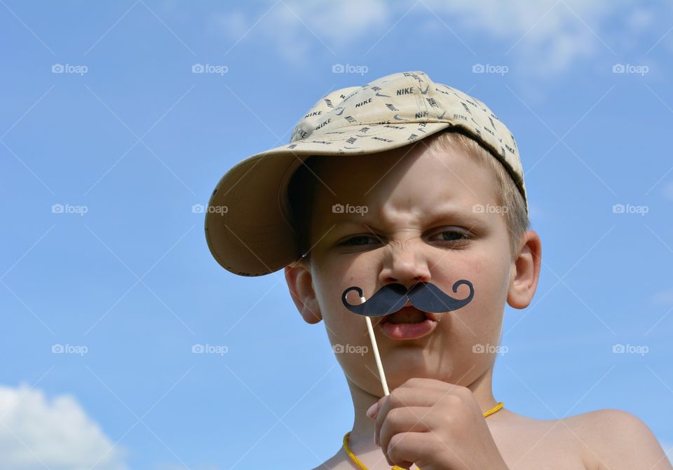 child boy portrait fun blue sky summer background