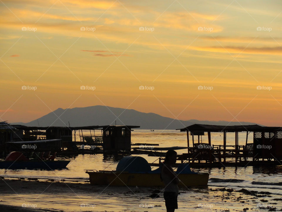 Scenic view of beach against sky during sunset 