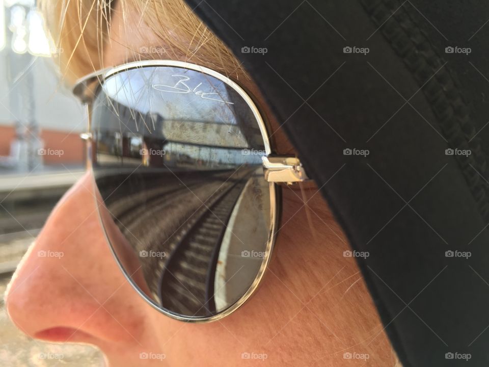 Reflecting on reflections. Train tracks reflecting in sunglasses