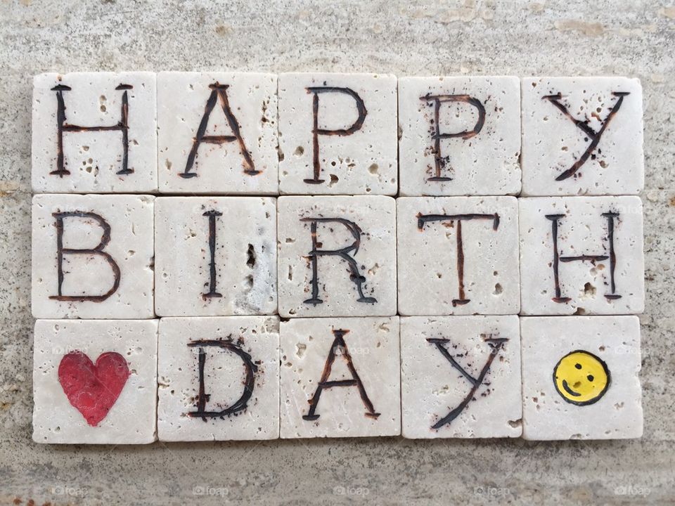 Happy Birthday on carved marble pieces