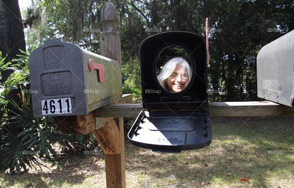 Look what the postman delivered today! There is a woman in my mail box! Peek-a-boo!
