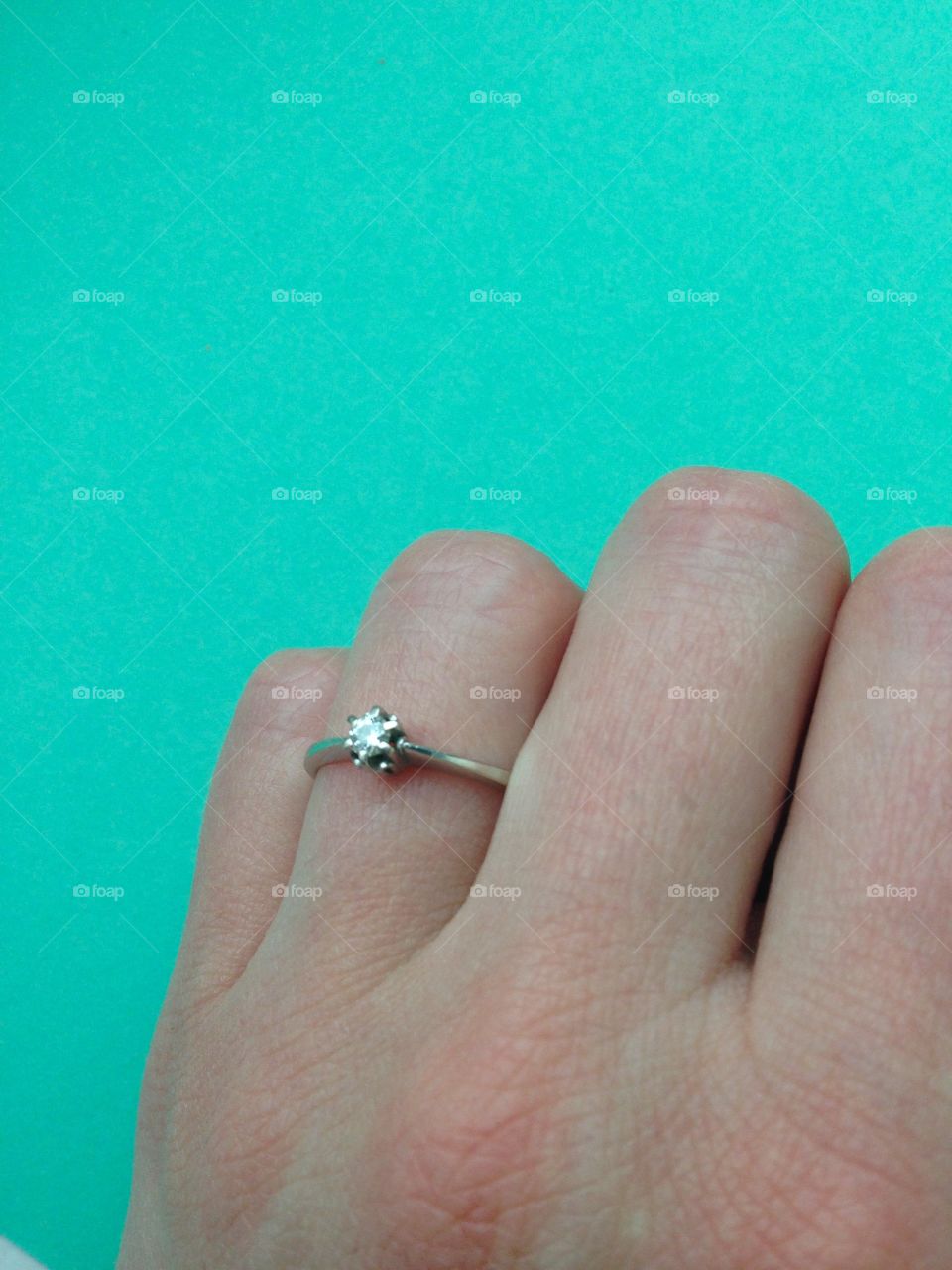 Ring with diamond on finger 