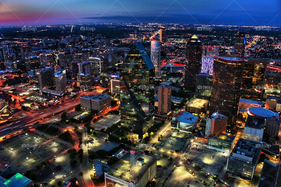 Aerial view of city glowing at night