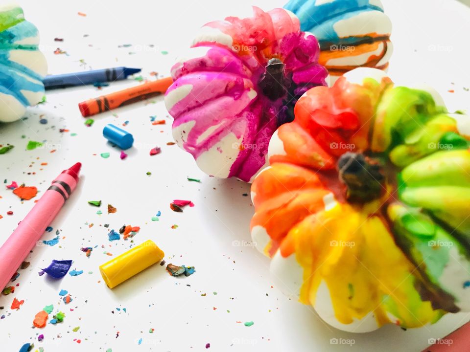 Melted crayons on pumpkins 