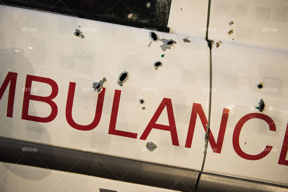 A real ambulance from the Red Cross who had been attacked in war. The Ambulance has bulletholes just everywhere and even firebombs have been thrown against it. The ambulance is part of efforts to make people aware of what happens in war. Ambulance shown up in various parts of the world. The picture is from Malmö Sweden.