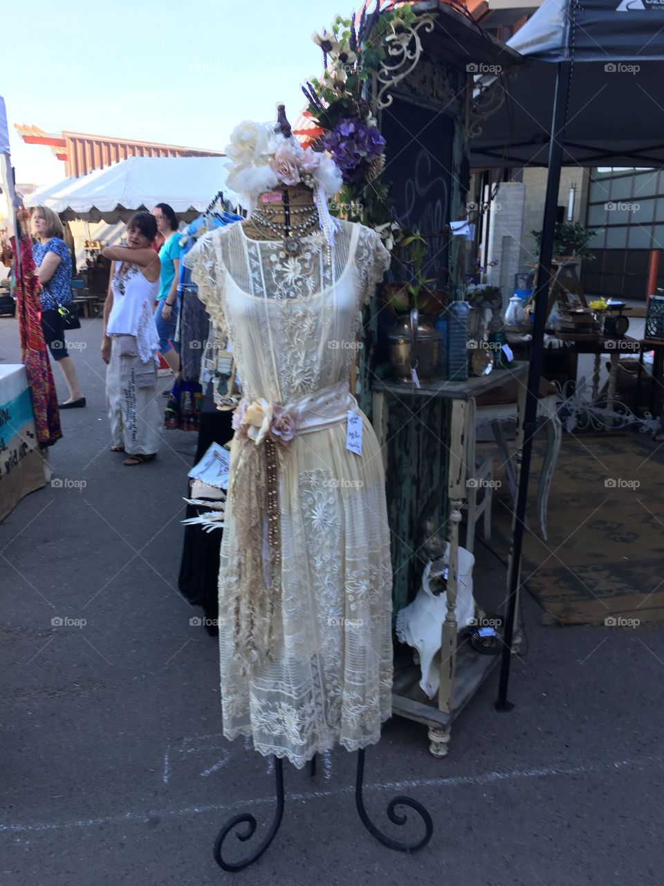 Scottsdale/Arizona, Circa August 2016, Vintage dress hangs on mannequin at Junk In The Trunk flee mart.  