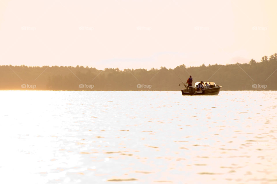 Fishing on Lake Winnepesaukee at sunrise