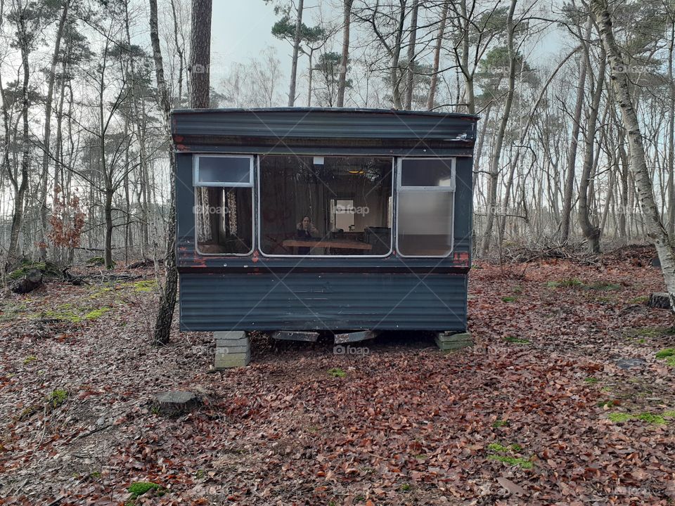 mobile home in the middle of the forest
