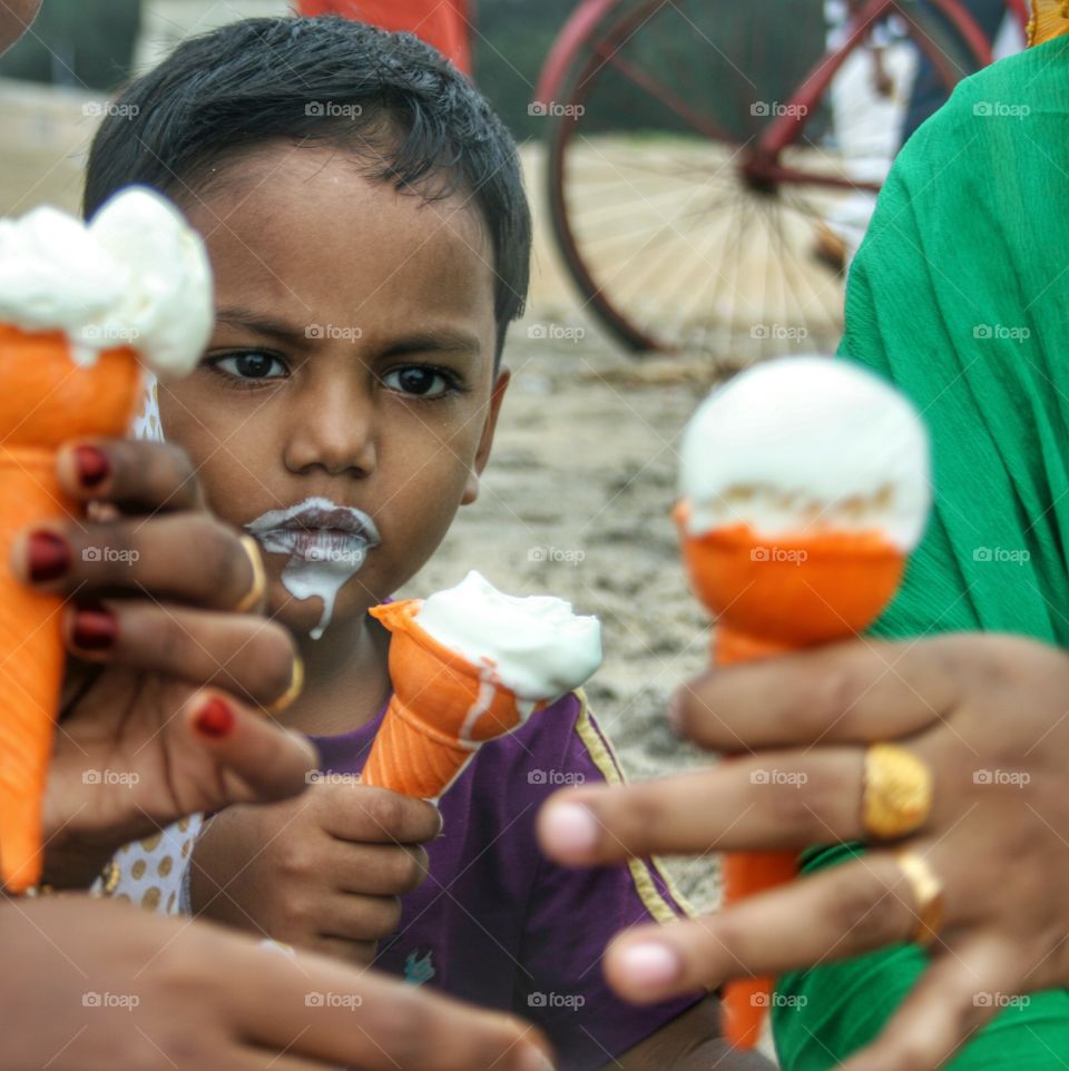 Portrait of a baby eating ice-cream