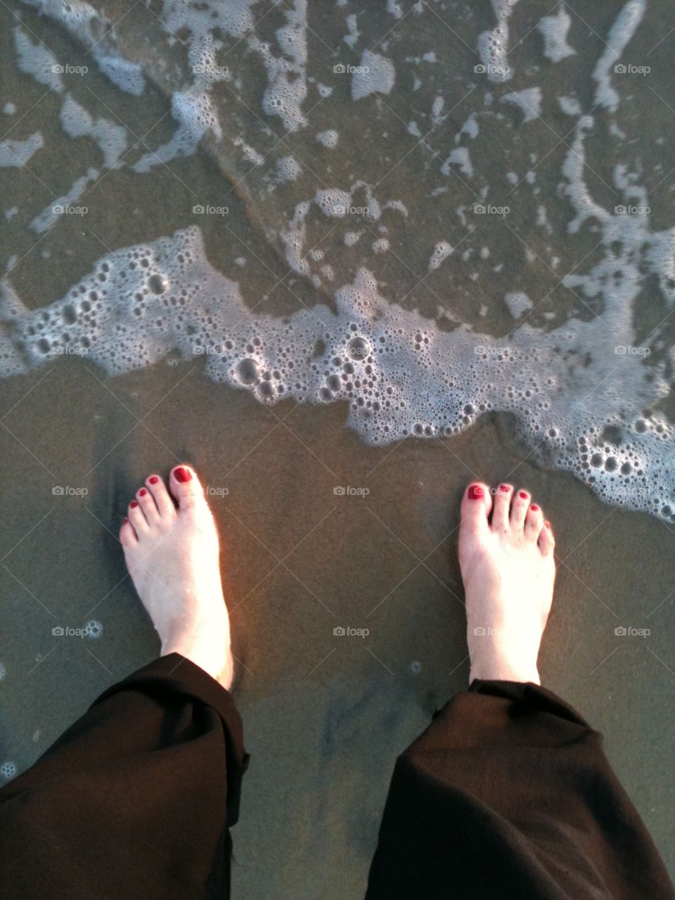 Barefoot. Barefoot in the sand at the ocean. 