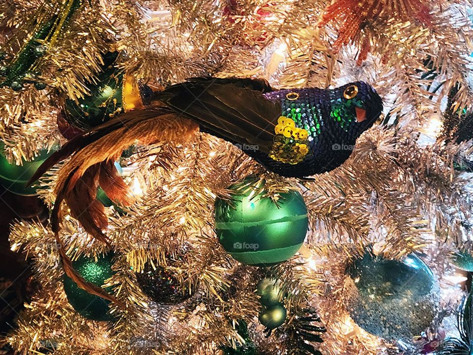 beautiful delicate vintage bird ornament on holiday tree decor