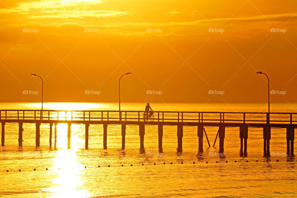 Sunrise and bicycle. Sun is rising and riding