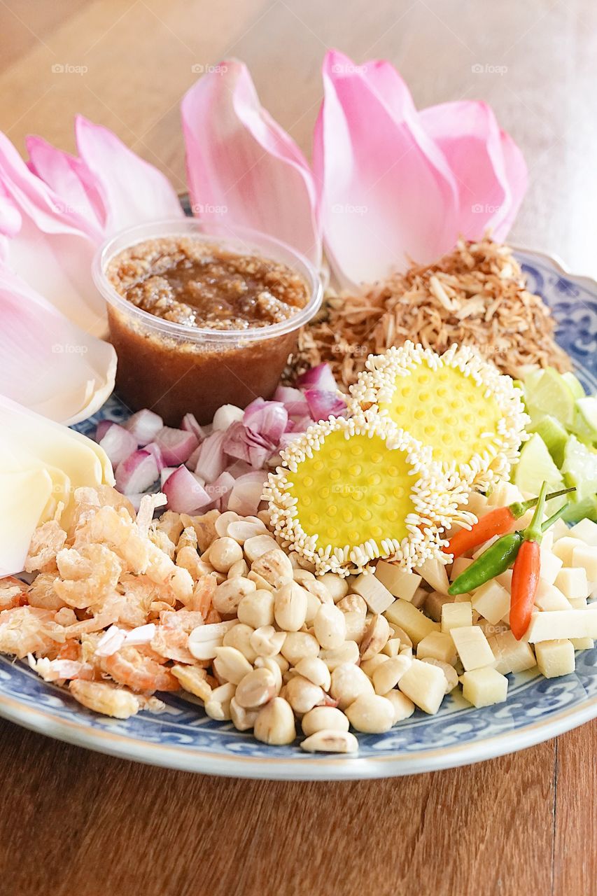 Miang kham with water lilies. Miang kham is traditional snack appetizer from Thailand and Loas. Miang kham means one bite wrap or food wrap in leaves. Clean food and healthy diet