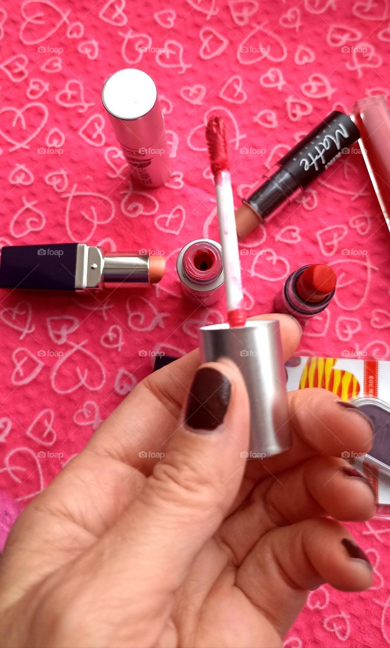 lipstick in the female hand beauty product love