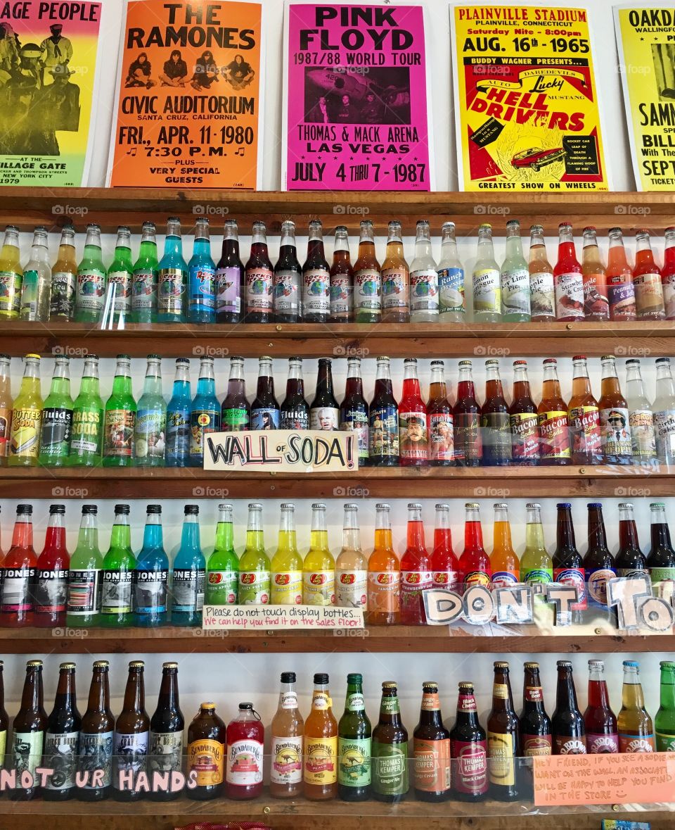 Colorful soda bottles on shelves 