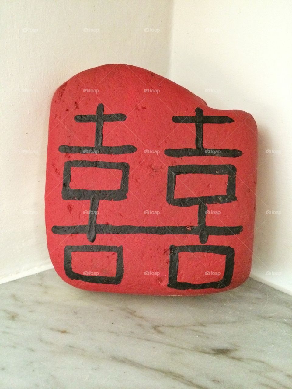 Chinese double happiness on a stone