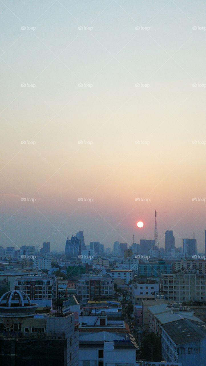 Sunset over Bangkok city skyline in Thailand.