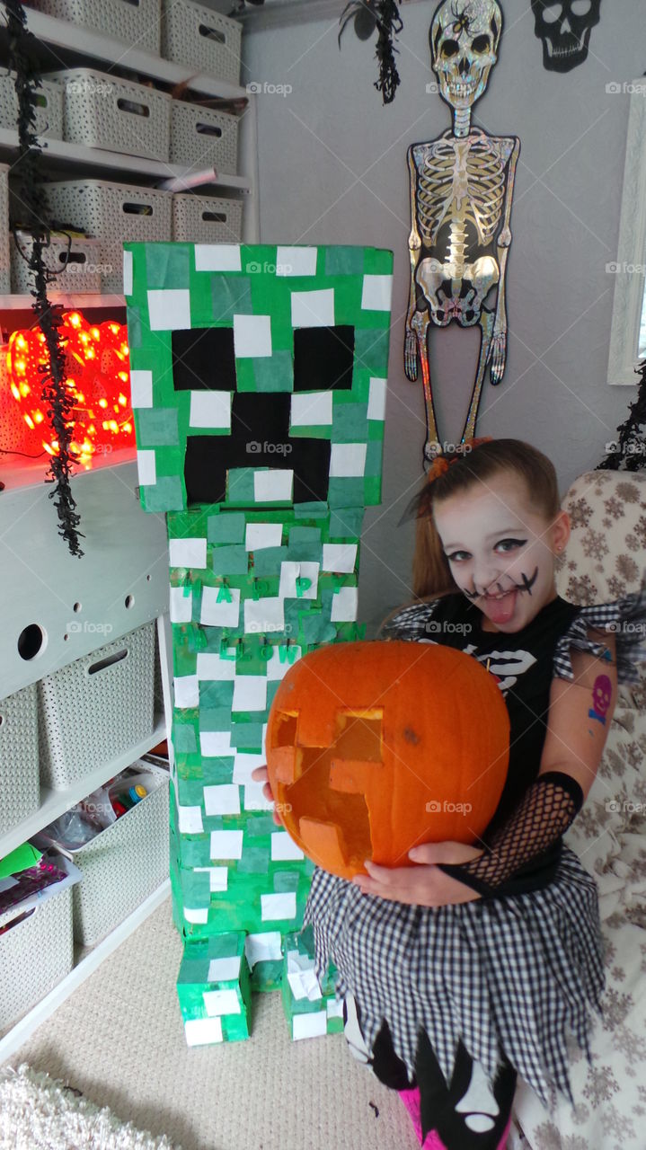mine craft themed Halloween costume and pumpkin. creeper