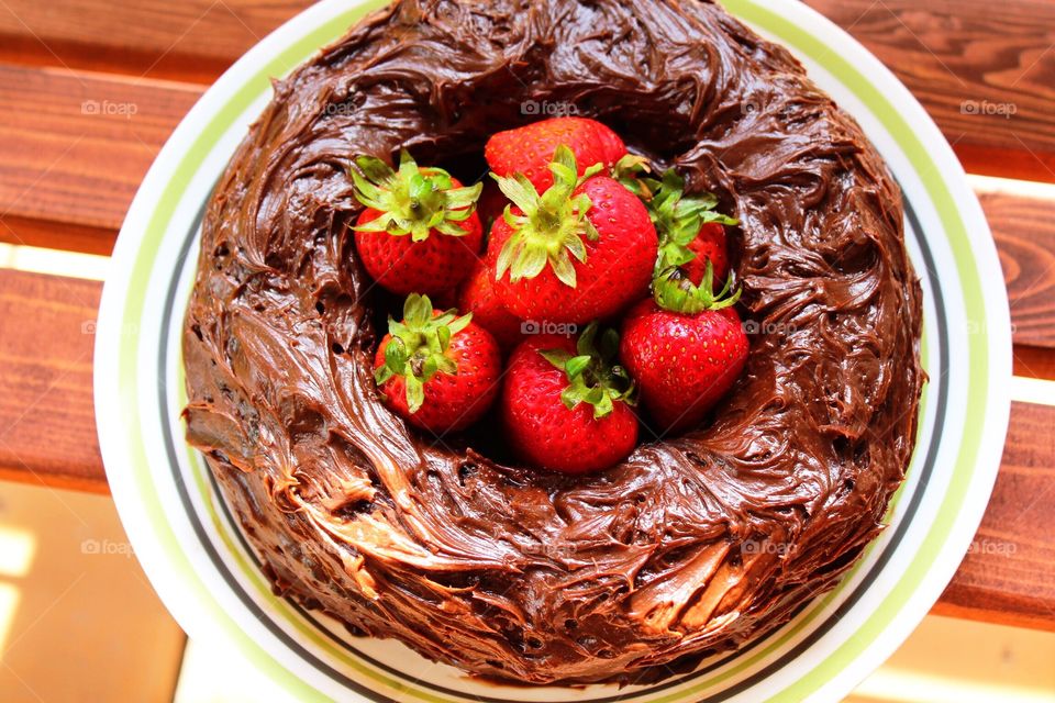 Flat lay chocolate cake with berries