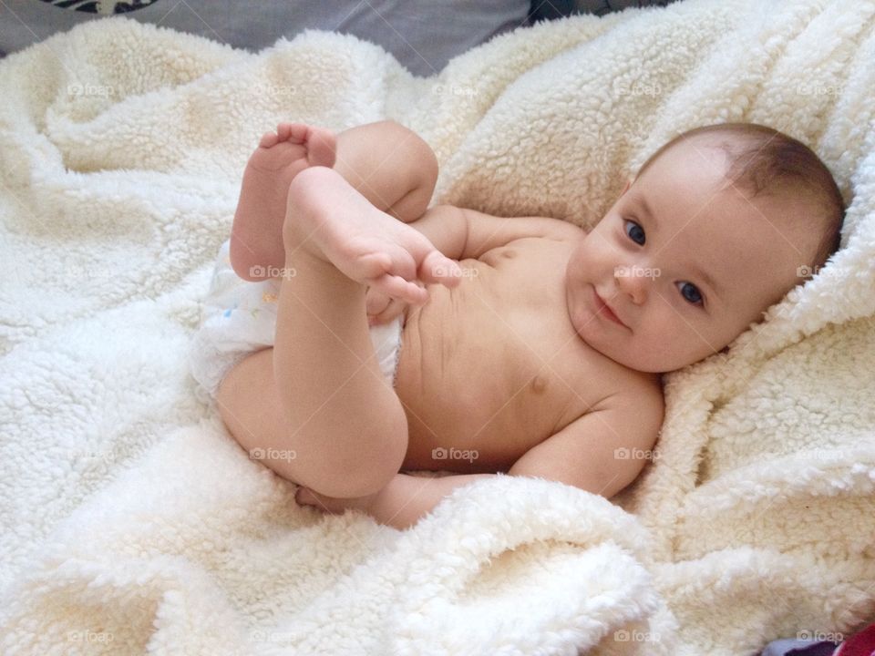 Cute baby on shaggy blanket 