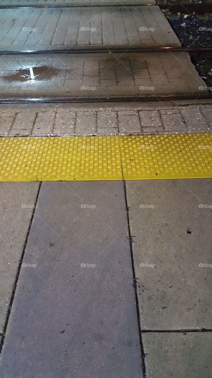 Stay behind the yellow line