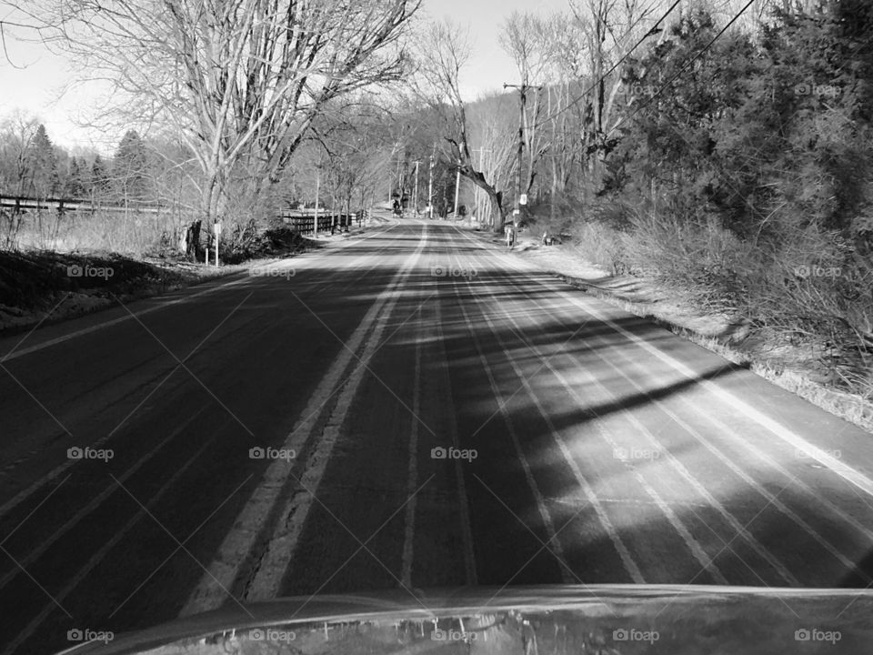 Black and white, icy road treatment 