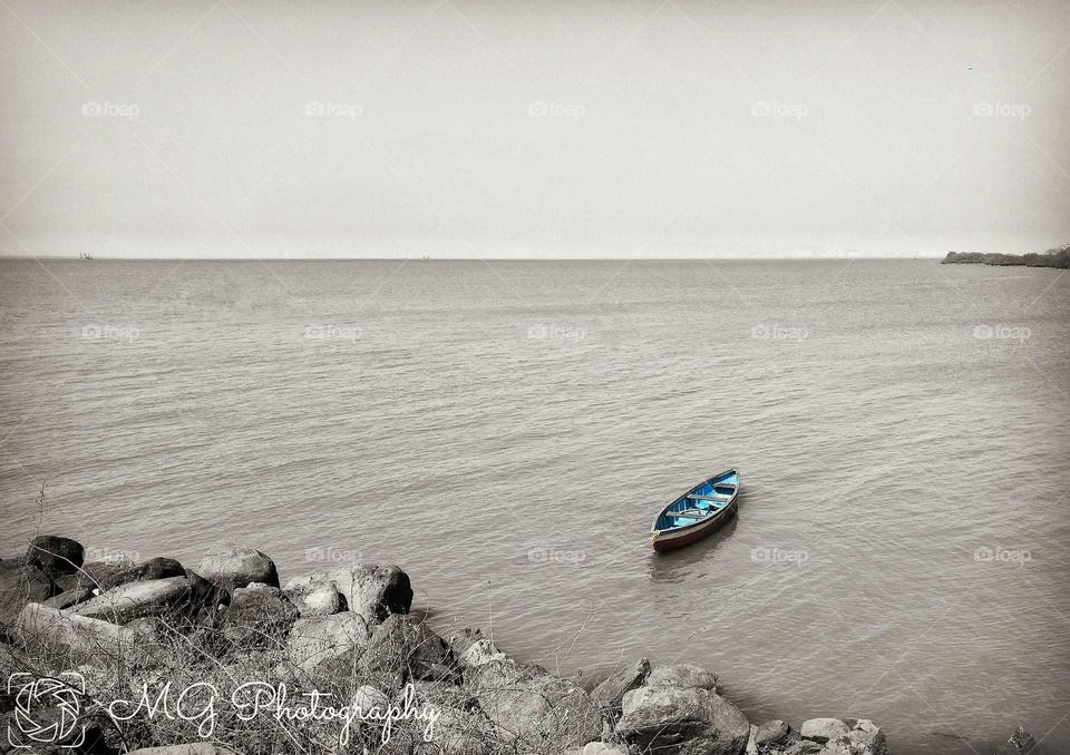 Fearless, alone, standing in the endless view. Seaside boat.