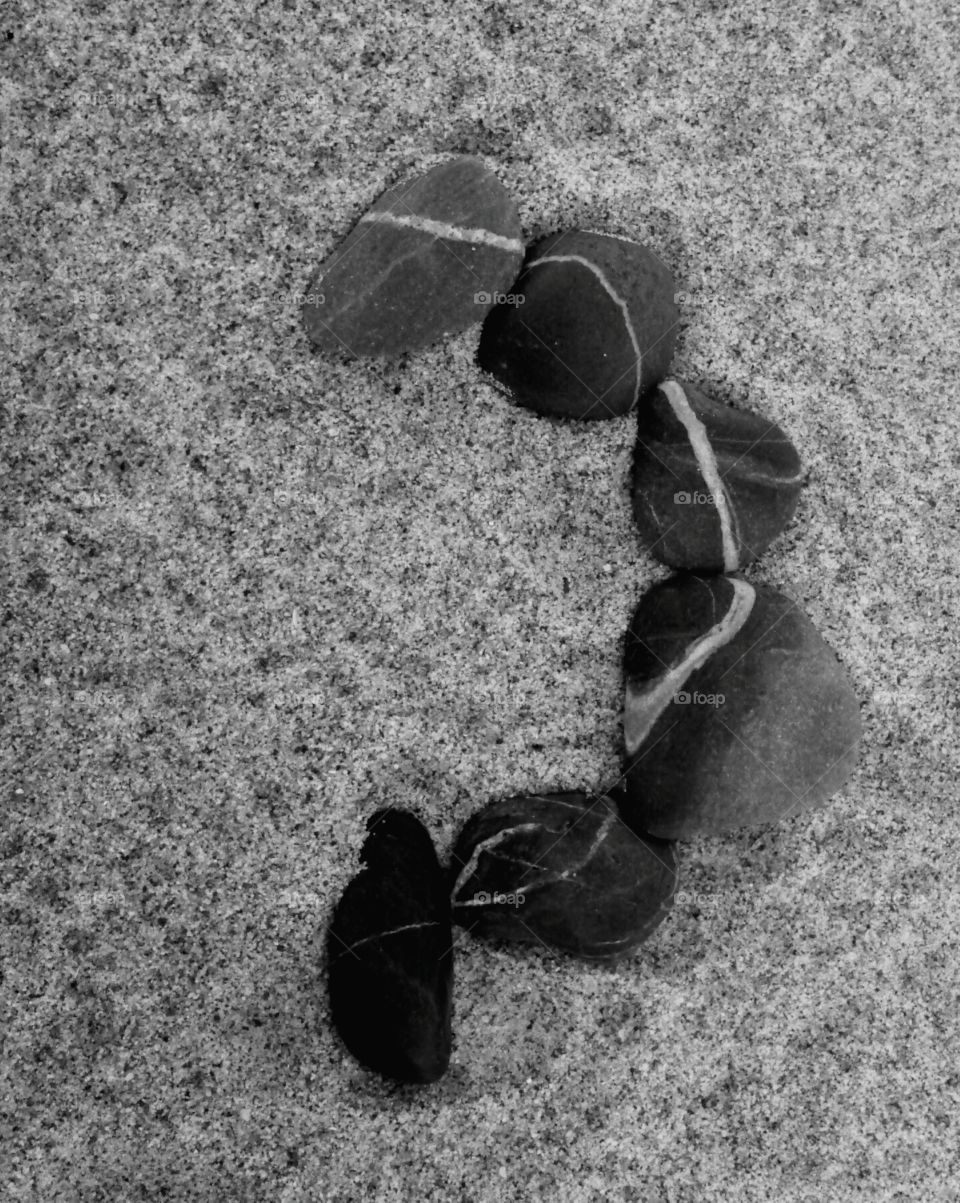 pebbles on a sandy beach