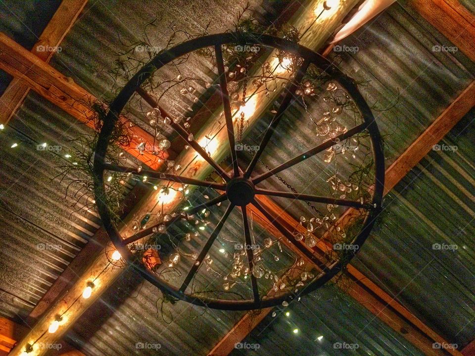  wheel decoration and lights in a barn 