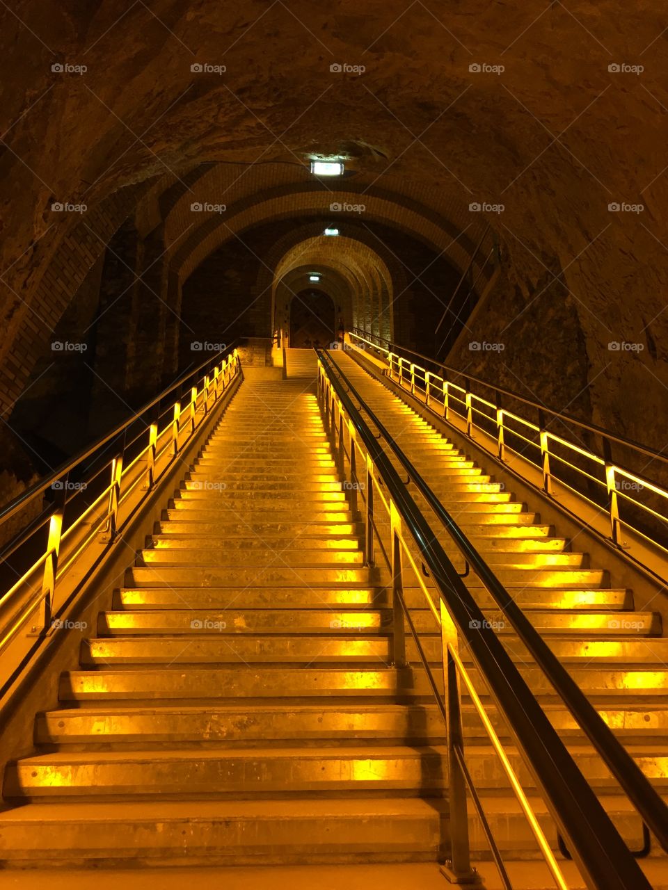 The golden stairway into the chalk cellars of  Veuve Clicquot in Reims, the capital of Champagne in France.
