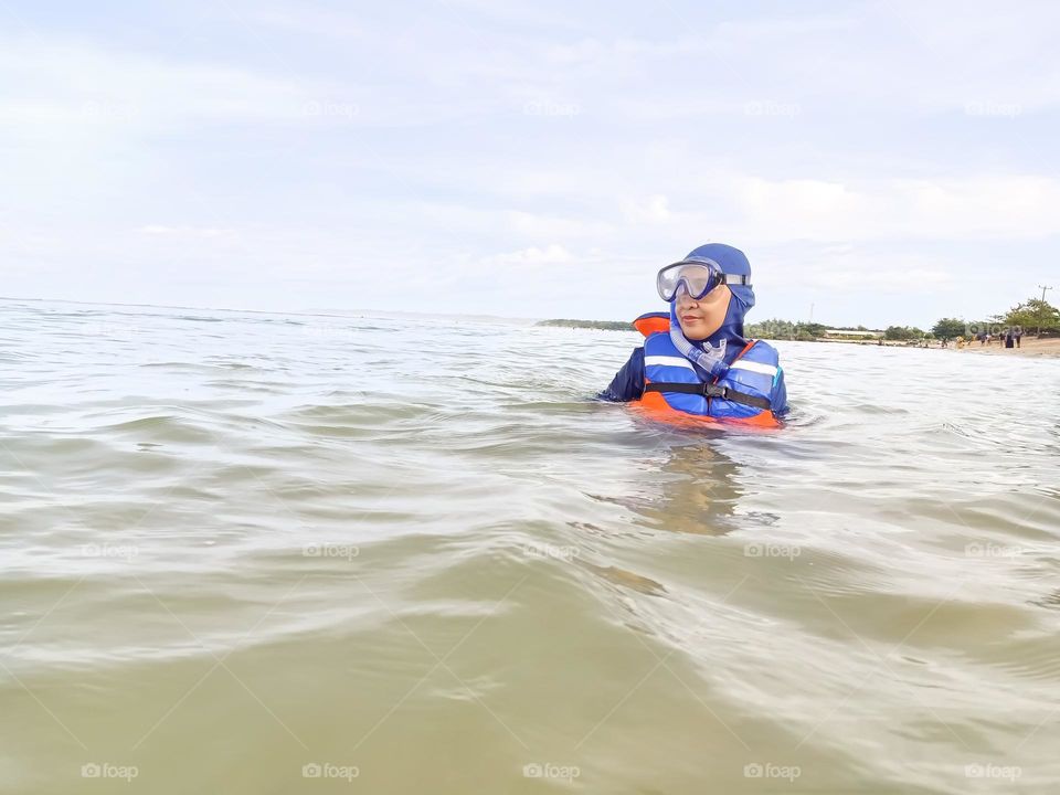 swimming in the beach