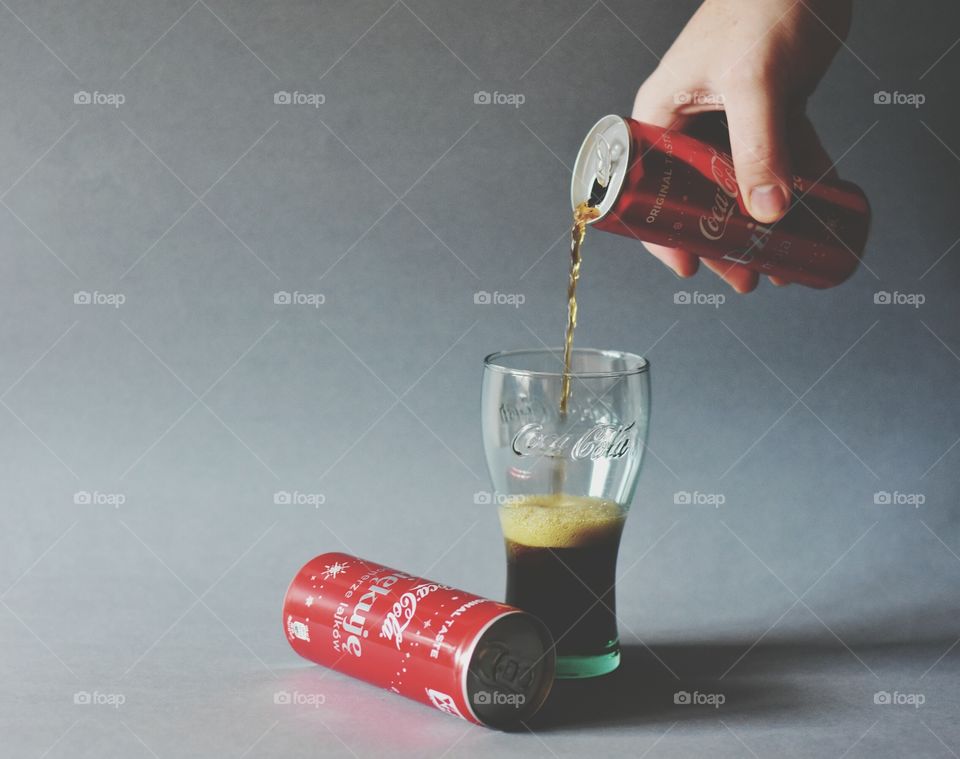 pouring cola in the glass