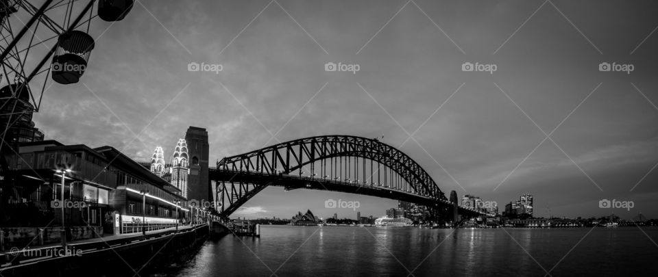 A last some rain - Luna Park on the left and the Sydney Harbour Bridge leading to the city