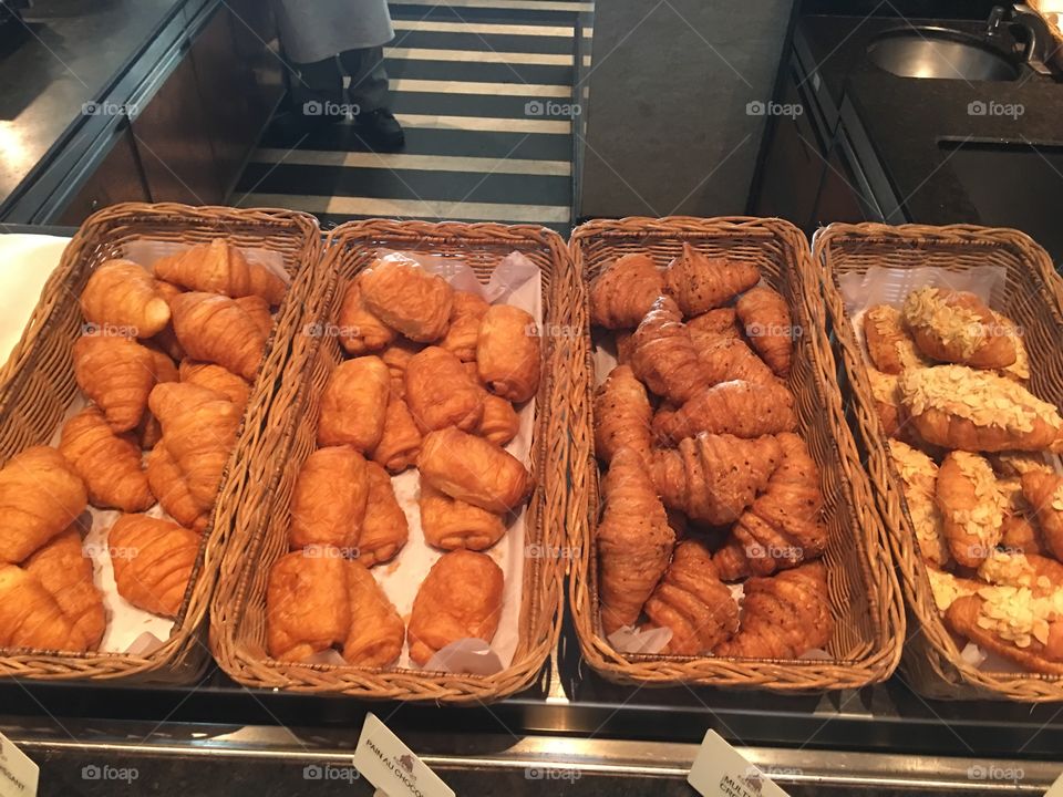 Danish pastry and breads at hotel breakfast buffet 