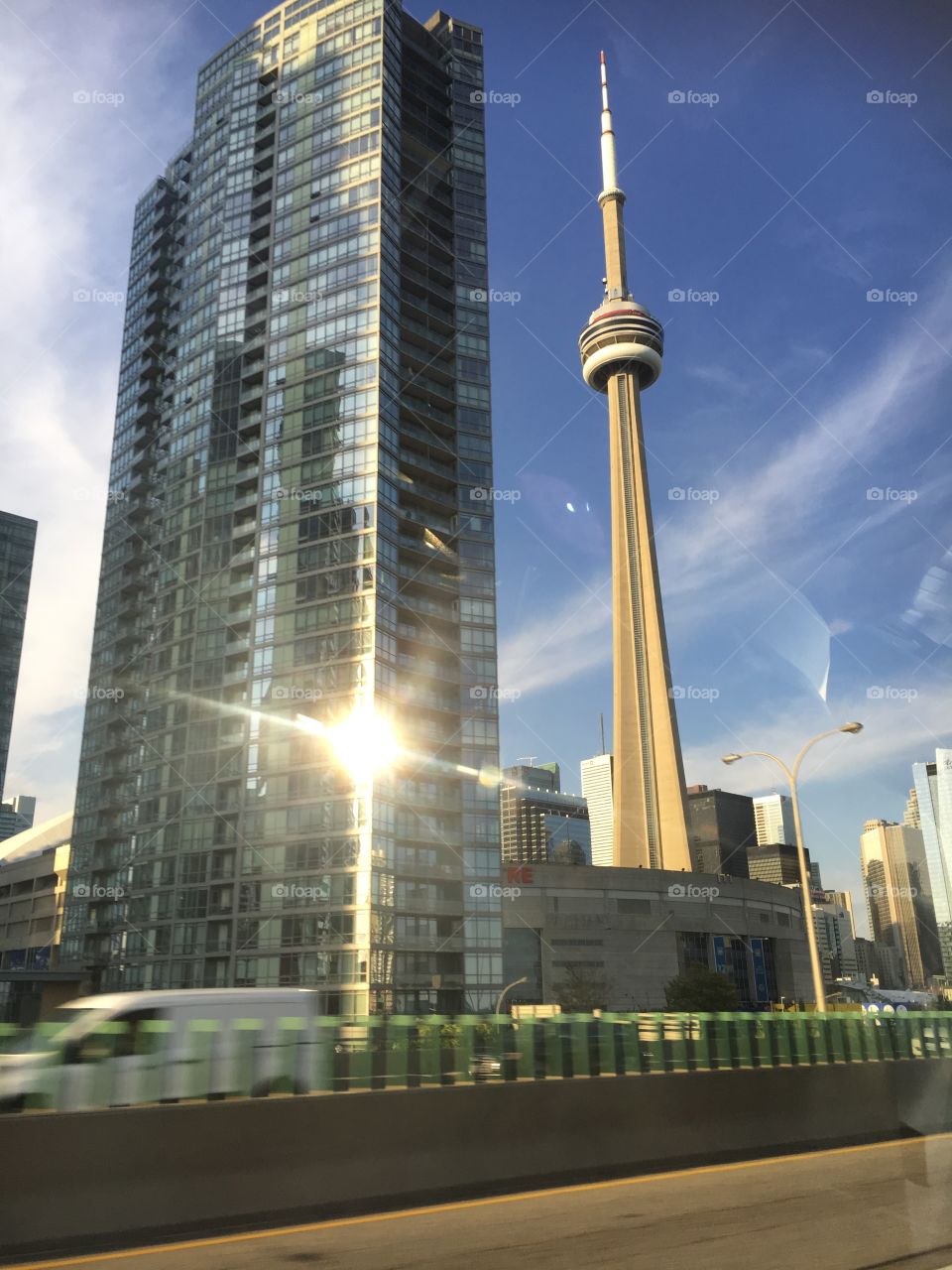 Sun glare off a skyscraper and the Toronto tower 
