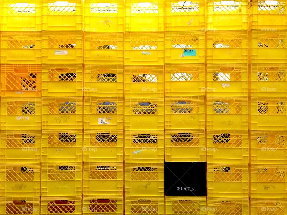 Saw these stacked outside the back of a grocery store.  It seemed perfect. 