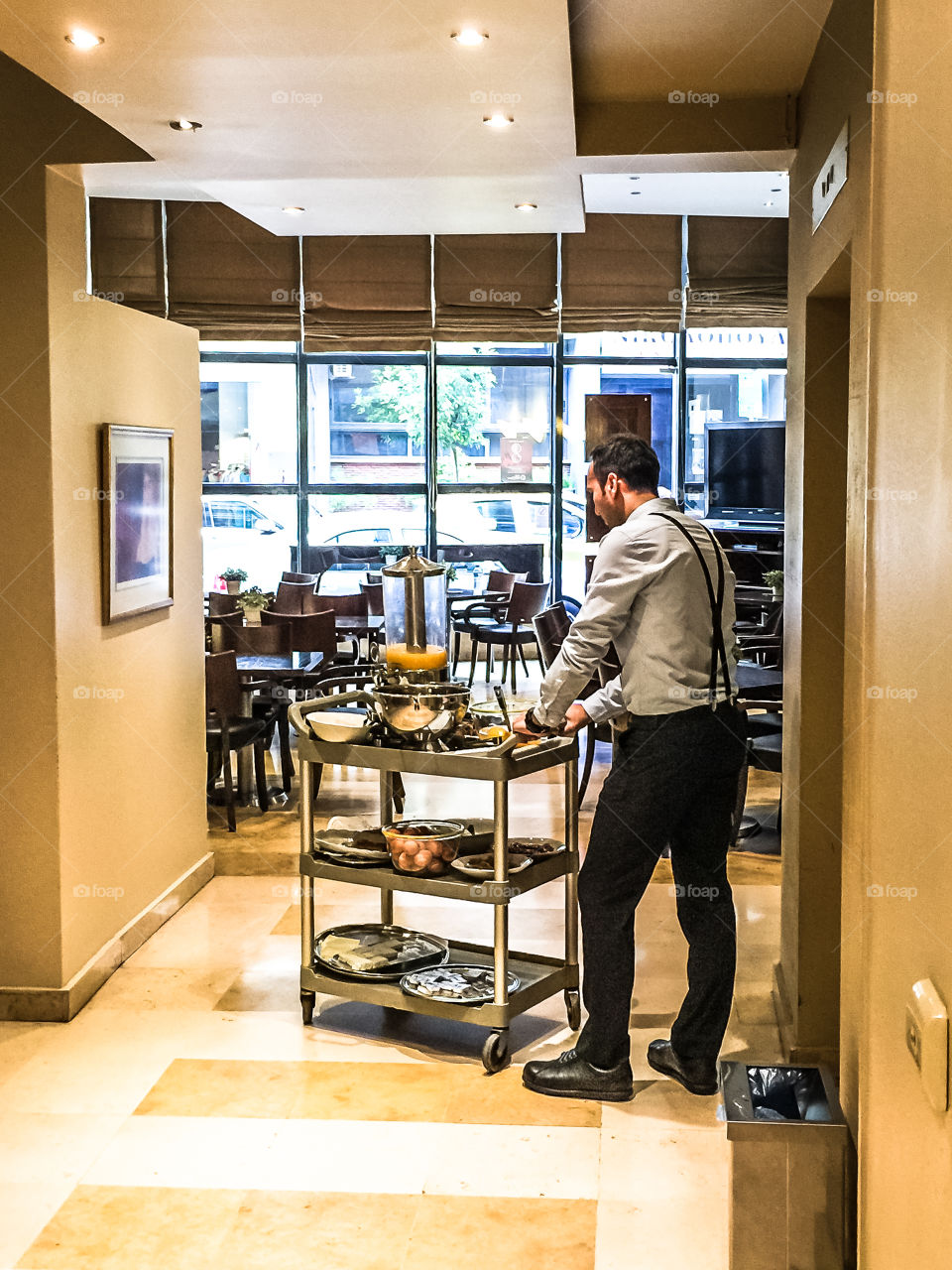 Hotel Employee Carries Breakfast To Hotel Room
