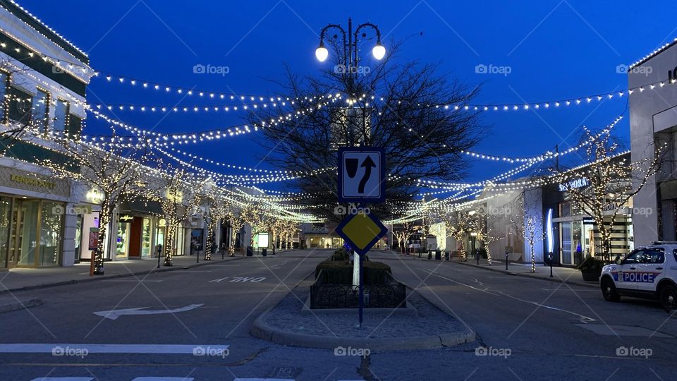 An early morning commute to the local Coffee bar. Few are out on this cold morning, but no doubt they have the same goal in mind. They’re greeted by holiday lights not yet taken down. Beautiful accents to the buildings and trees. 